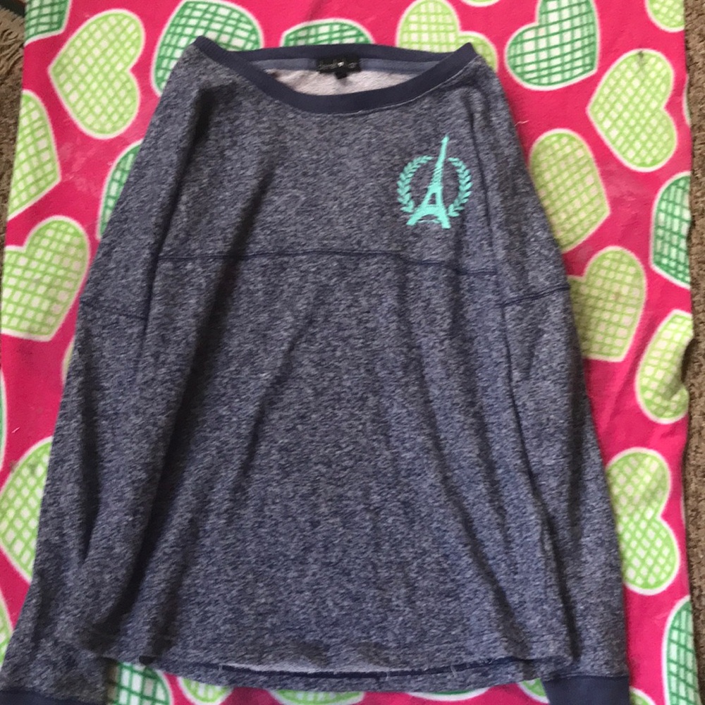 A pair a sweater with the word pink on the back